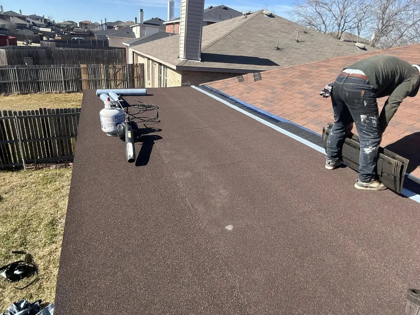 Shingle roof replacement in progress by RGS General Contracting