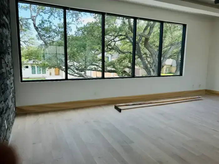 Freshly painted interior with a full window wall by RGS General Contracting