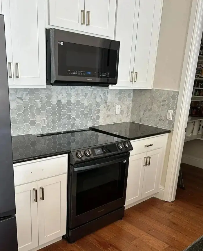 Kitchen remodel with appliance and backsplash installation by RGS General Contracting